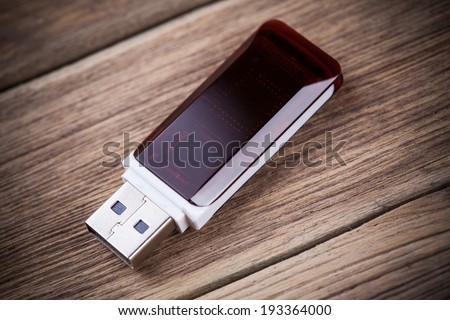 Closeup of pen drive on wooden background