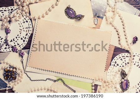 old paper sheets surrounded by retro women's accessories old paper sheets surrounded by retro women's accessories