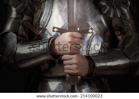 knight wearing armor and holding two-handed sword