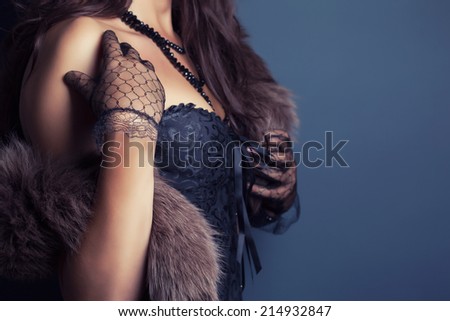 woman wearing corset and fur in retro style