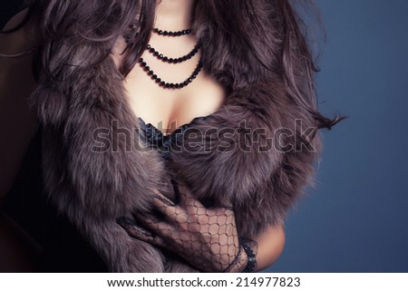 woman wearing corset and fur in retro style