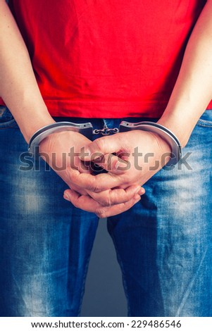 man hands in handcuffs