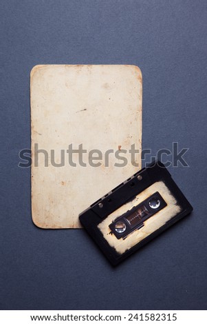 audio cassette with magnetic tape with vintage paper