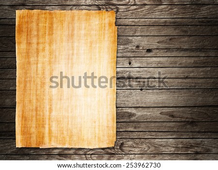 old papyrus paper on wooden background