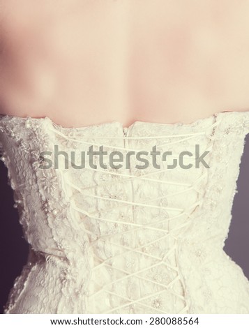brides back in wedding white dress with lace