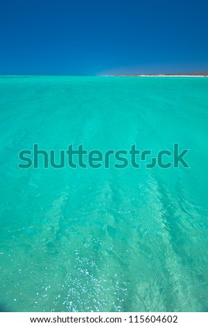 Turquoise water of Ningaloo reef lagoon in western australia. Waves ripple on the surface