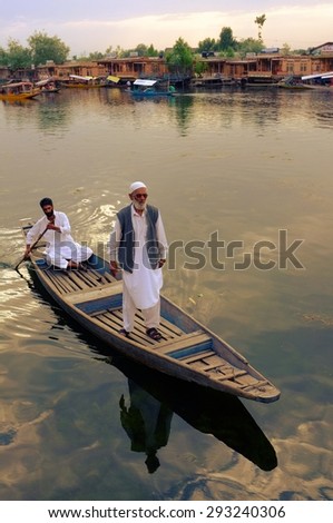 SRINAGAR, INDIA. June 23, 2012 : The old man muslim standing on the boat on Dal lake, Srinagar,India. Dal lake is famouse tourist place in North India