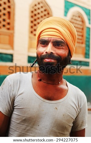 SRINAGAR, INDIA. JUNE 24, 2012 : The Indian worker man poses for a portrait at old town in Srinagar, North of India