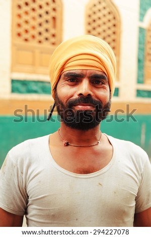 SRINAGAR, INDIA. JUNE 24, 2012 : The Indian worker man poses for a portrait at old town in Srinagar, North of India