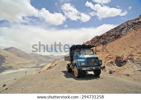 LADAKH, INDIA - JUNE 14, 2012 : Truck running on the high altitude Ladakh-Leh road in himalayan mountain, state of Jammu and kashmir,  India