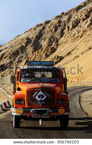 LADAKH, INDIA - JUNE 13, 2012 : Truck running on the high altitude Ladakh-Leh road in himalayan mountain, state of Jammu and kashmir, India