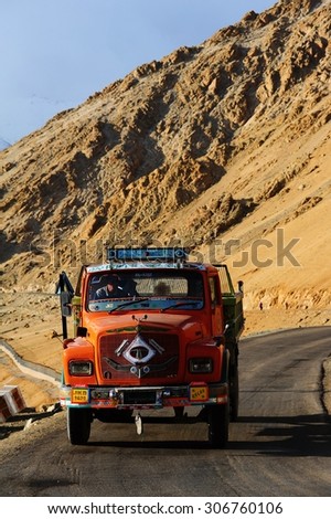 LADAKH, INDIA - JUNE 13, 2012 : Truck running on the high altitude Ladakh-Leh road in himalayan mountain, state of Jammu and kashmir, India