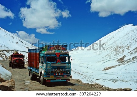 LADAKH, INDIA - JUNE 14, 2012 : Truck running on the high altitude Ladakh-Leh road in himalayan mountain, state of Jammu and kashmir, India