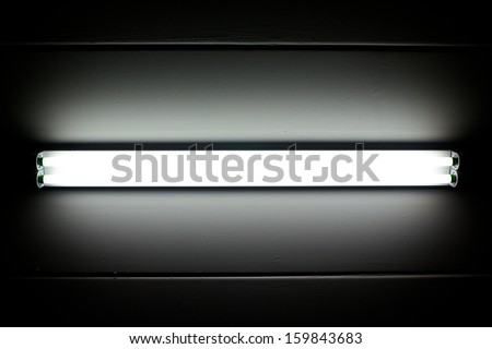 a fluorescent tube mounted on a wall