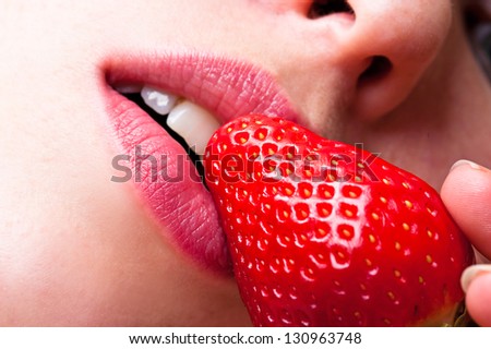 macro sweet strawberries and lips woman