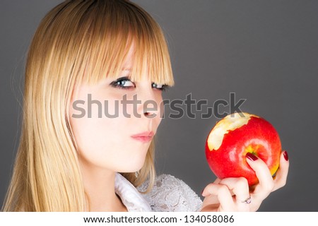 beautiful blond biting the apple
