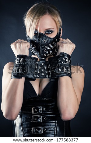 woman slave in a mask with spikes