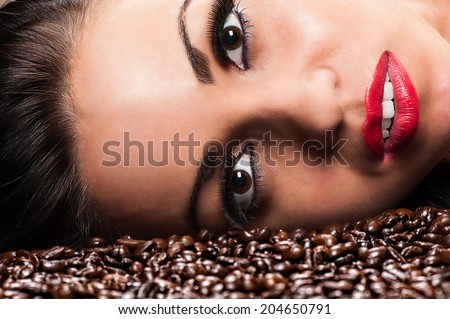 beautiful woman face with coffee beans