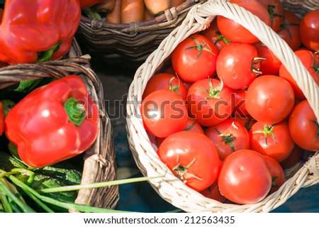basket with different vegetables, a basket of tomatoes