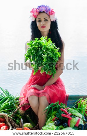 woman sitting on the edge of the boat with parsley in hand