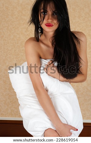 sexy long hair woman with pillow in bed