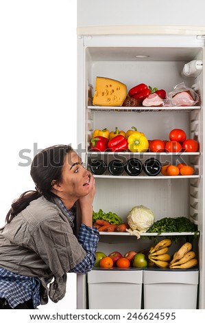 hungry woman and a fridge full of food