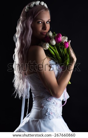 charming woman with a bouquet of tulips