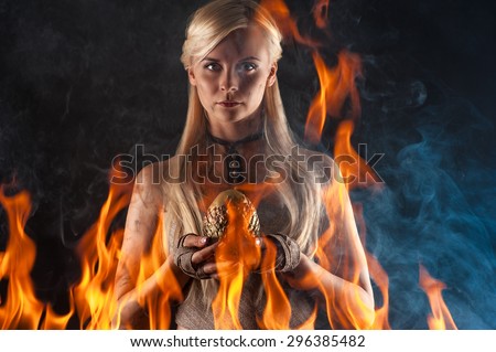 beautiful woman with a dragon egg in hands