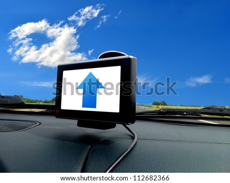 Blue forward arrow on gps system in car