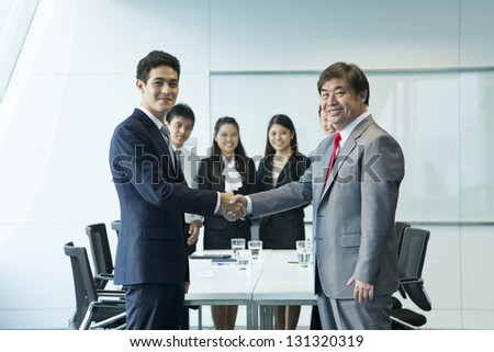 Business people in meeting room.