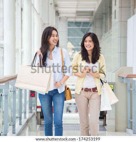 Happy young Asian women shopping.