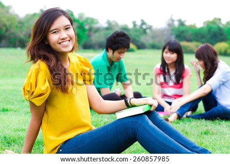Young people hanging out in the park.