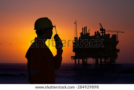 Oil and gas operator discussing.