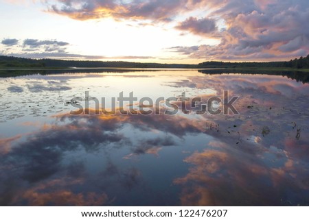 Reflection of the sunset in the Lake Pocha on Russian North.
