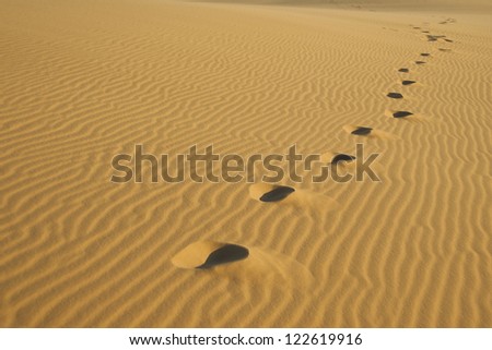 Footprints in the sand dunes in Mui Ne, Vietnam.