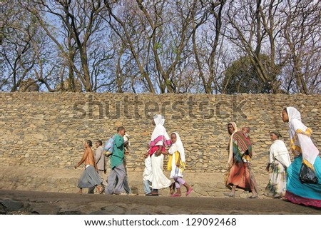 GONDER, ETHIOPIA - MARCH 25: Unidentified Ethiopian people walk to church service during annual Abye Tsome (Great Fast) in Gonder, Ethiopia on March 25, 2012. White clothes mean fasting in Ethiopia.