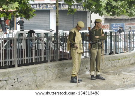 SRINAGAR, INDIA - MAY 4: Unidentified Indian policemen on a street of Srinagar, India, May 4, 2009. Additional security measures have been taken before elections to the Parliament in a spring 2009.