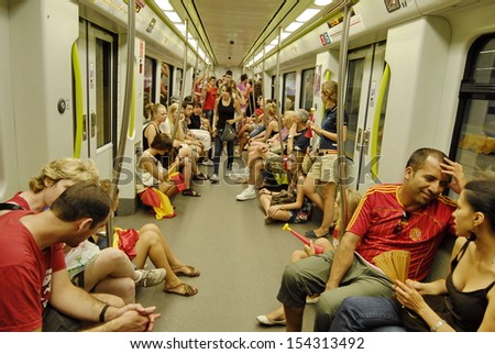 VALENCIA, SPAIN - JULY 11: Unidentified Spanish fans ride the subway to see the TV translation of the final match of the World Cup 2010 at the stadium in Valencia, Spain on July 11, 2010.