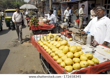 NEW DELHI, INDIA - MAY 23: Unidentified street vendor sells mangoes on a Main Bazaar street on May 23, 2009 in New Delhi, India. May is mangoes picking season in India.