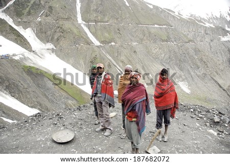 KASHMIR, INDIA - MAY 20: Unidentified road builders on Zoji La, Srinagar - Leh road, India, May 20, 2009. Zoji La is a Himalayan pass  at elevation of 3,528 m. It\'s the most dangerous pass in Kashmir.