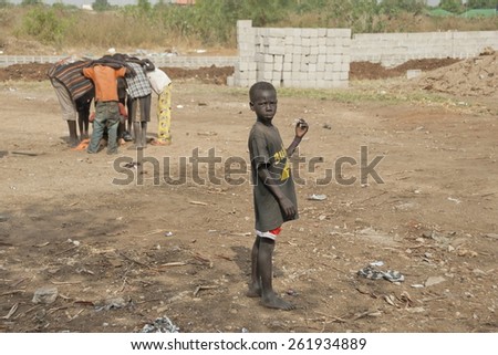 JUBA, SOUTH SUDAN - FEBRUARY 26: Unidentified kids play on a street of Juba on February 26, 2012 in Juba, South Sudan. Juba is full of refugees who live with their children in appalling conditions.