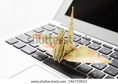 Paper crane and keyboard