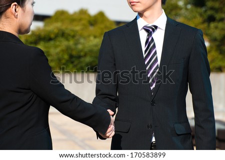 Handshake of men and women