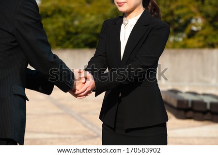Handshake of men and women