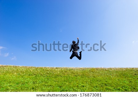 Businessmen suit to jump high into the sky blue sky