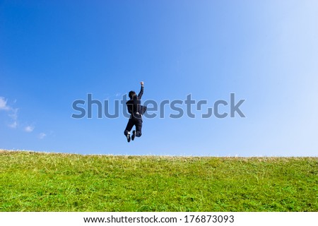 Businessmen suit to jump high into the sky blue sky