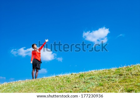 Woman pointing at the sky