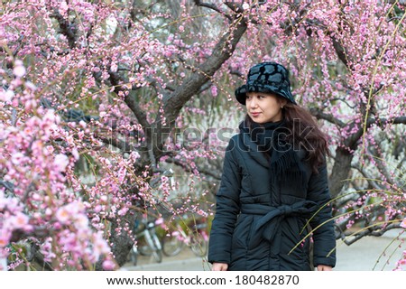 Women and plum tree
