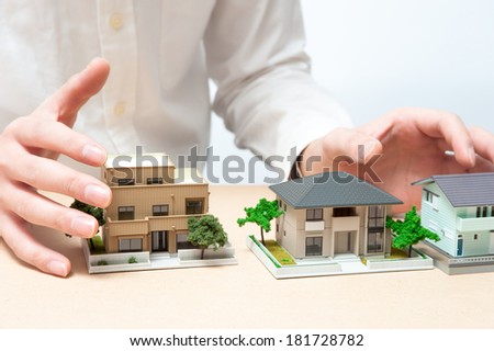 Photo of hand of man to introduce housing