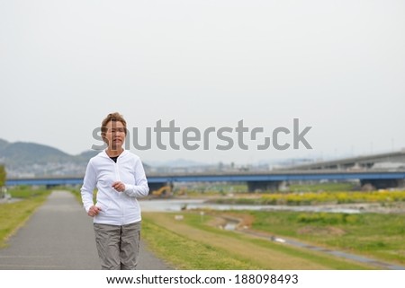 Older women that are jogging healthy way of the river bank